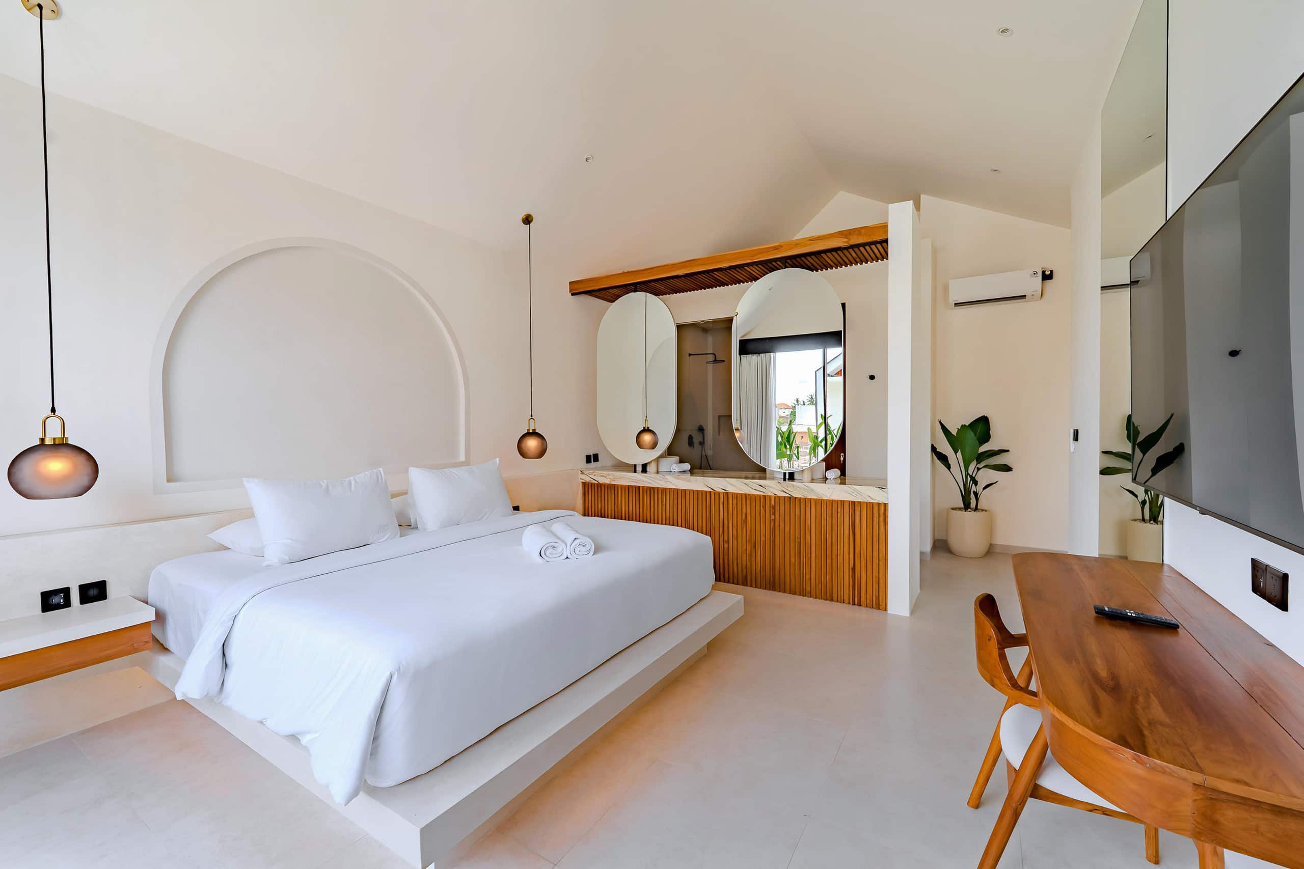 Bedroom with a desk in a One Bedroom villa